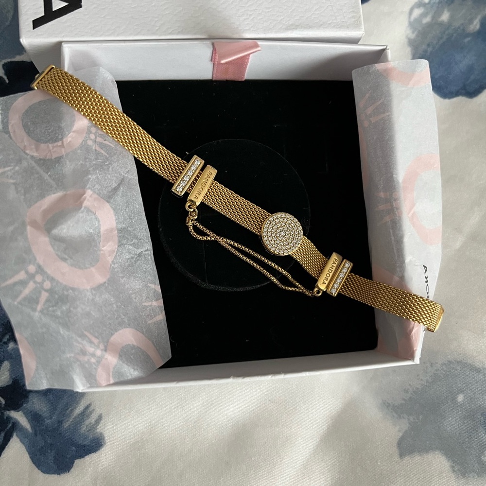 Pandora gold plated mesh bracelet with charms